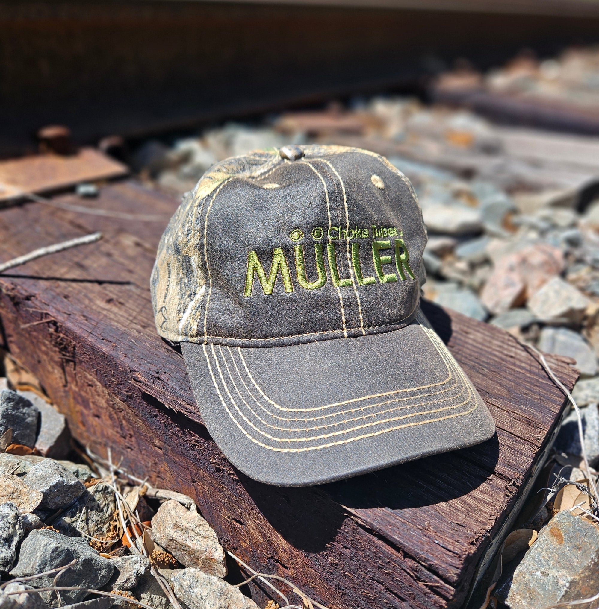 *CAP* Brown Muller Chokes Hunting Cap. Front: Yellow-Green Logo, Back: NEW REALTREE EDGE Camo