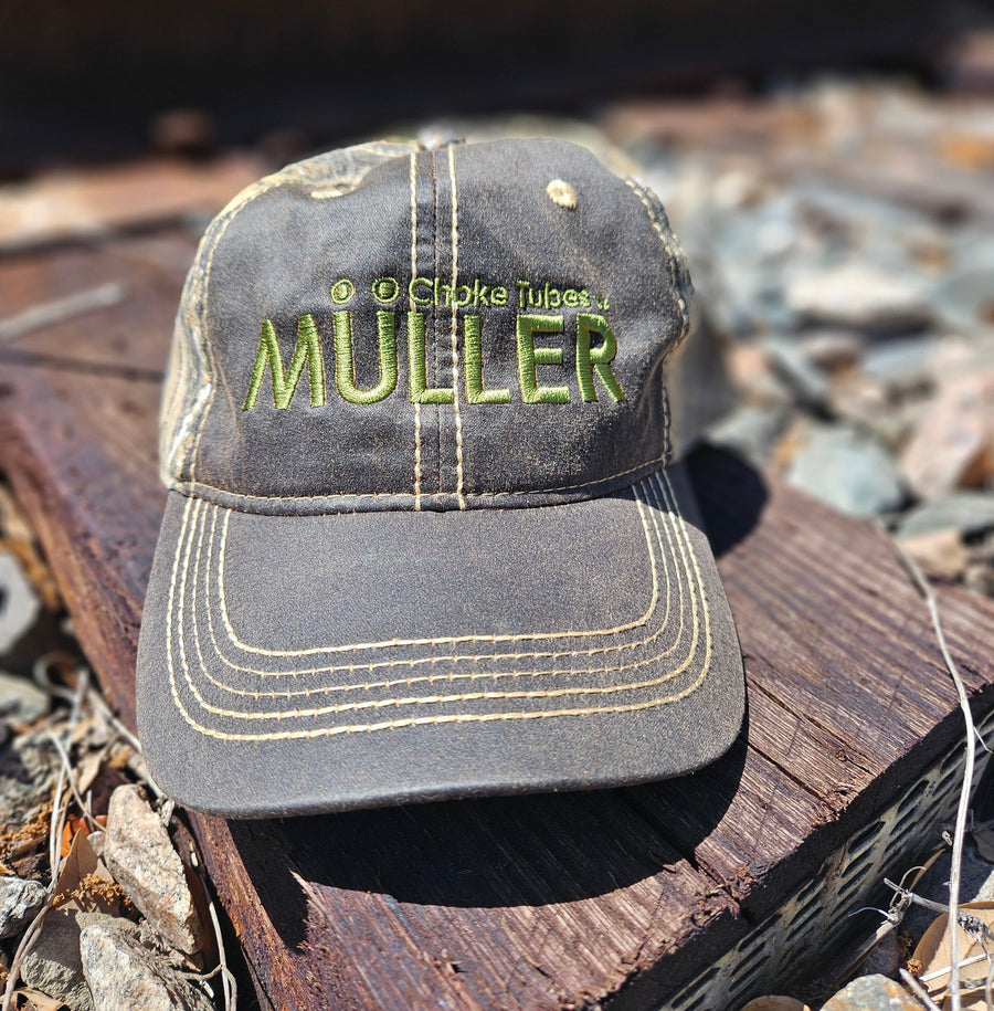 *CAP* Brown Muller Chokes Hunting Cap. Front: Yellow-Green Logo, Back: NEW REALTREE EDGE Camo