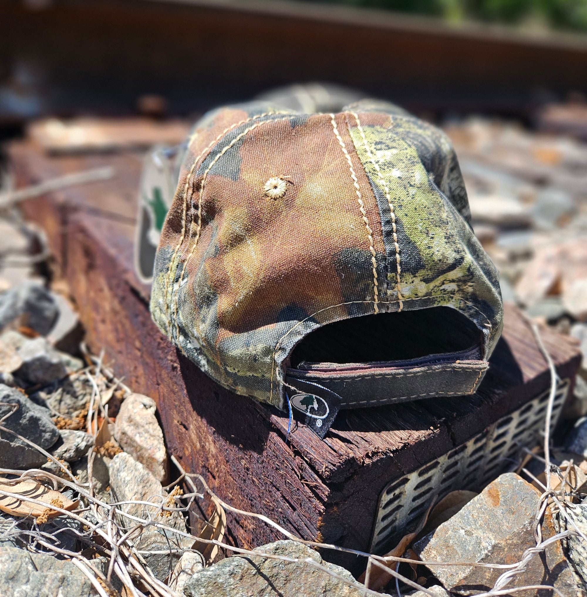 *CAP* Brown Muller Chokes Hunting Cap. Front: Yellow-Green Logo, Back: Mossy Oak New Break Up Camo