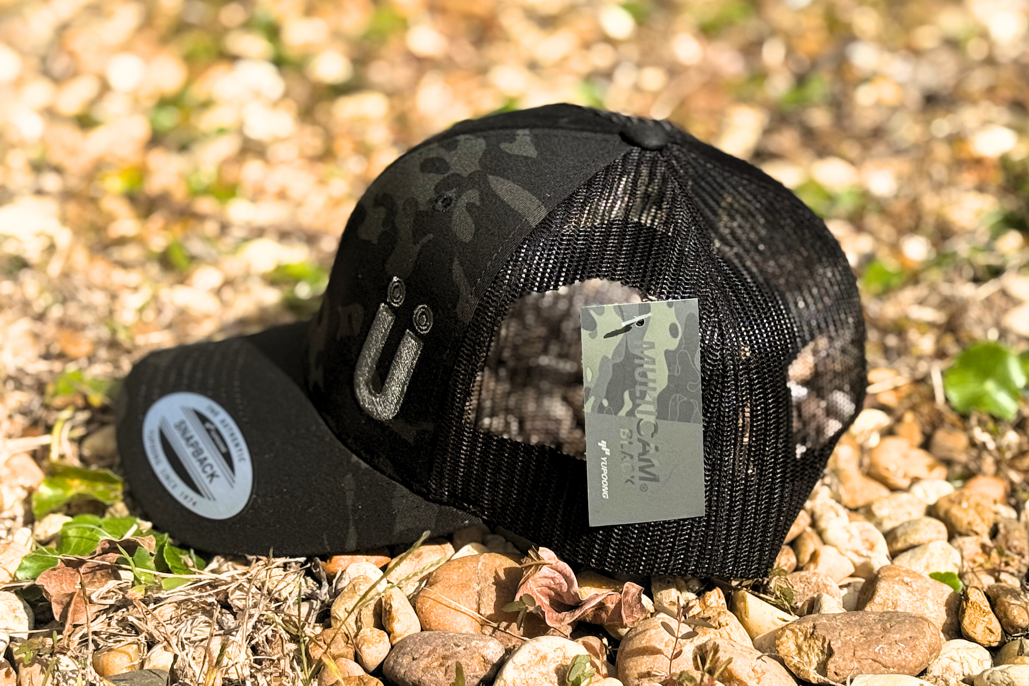 *CAP* U BLACK CAMO Muller Chokes Hunting Cap. Front: Black Camo, Back: Black Trucker Mesh