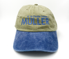 *CAP* Khaki & Denim Muller Chokes Shotgunning Cap. Front: Blue Logo, Back: Buckle Detail